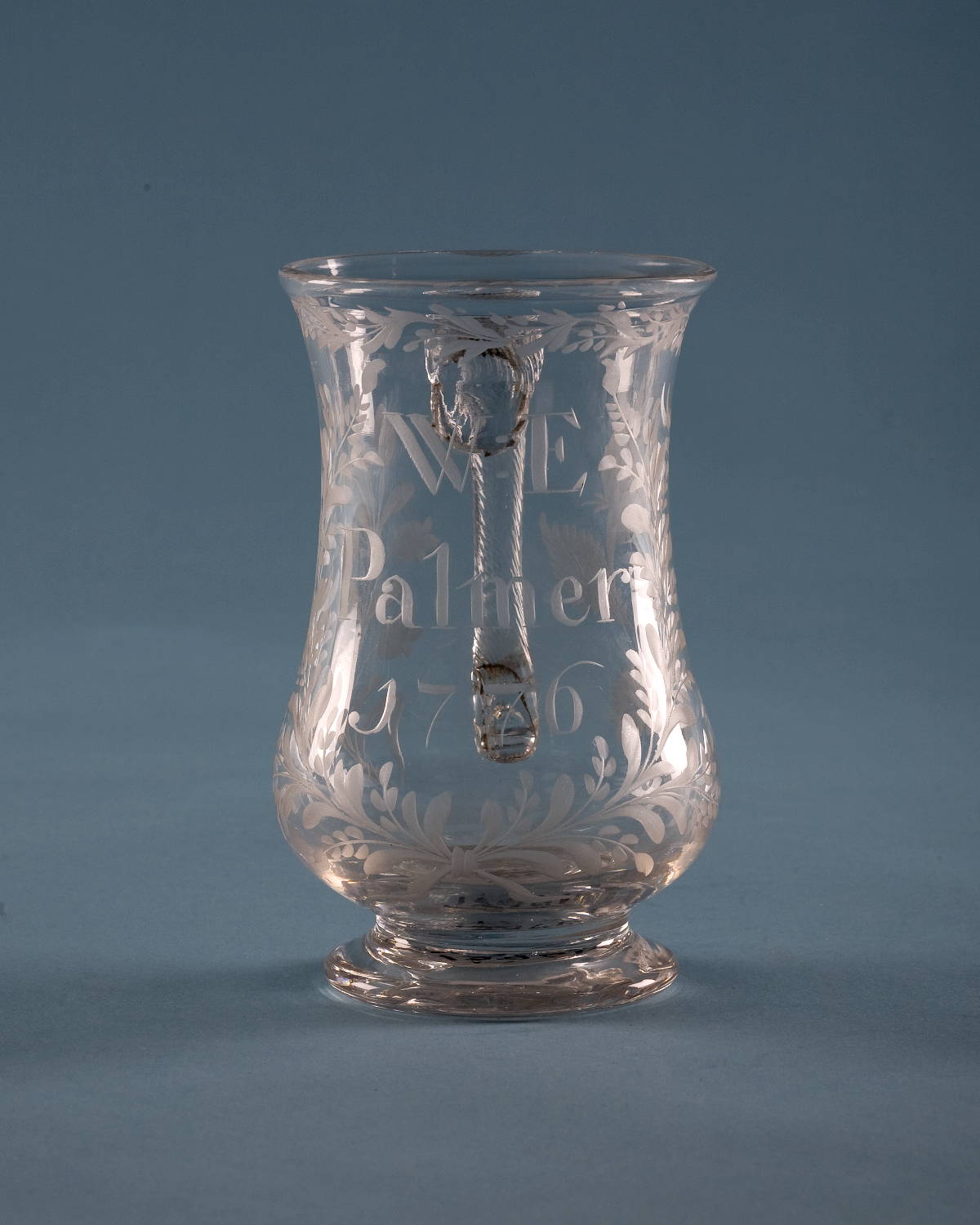 Appraisal: ENGRAVED COLORLESS GLASS BALUSTER MUG INSCRIBED W E Palmer Height