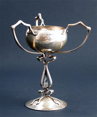 Appraisal: A Mappin Webb silver cup hammered domed foot supporting tripod