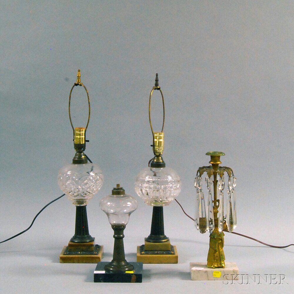 Appraisal: Four Lighting Devices three colorless glass oil lamps two electrified