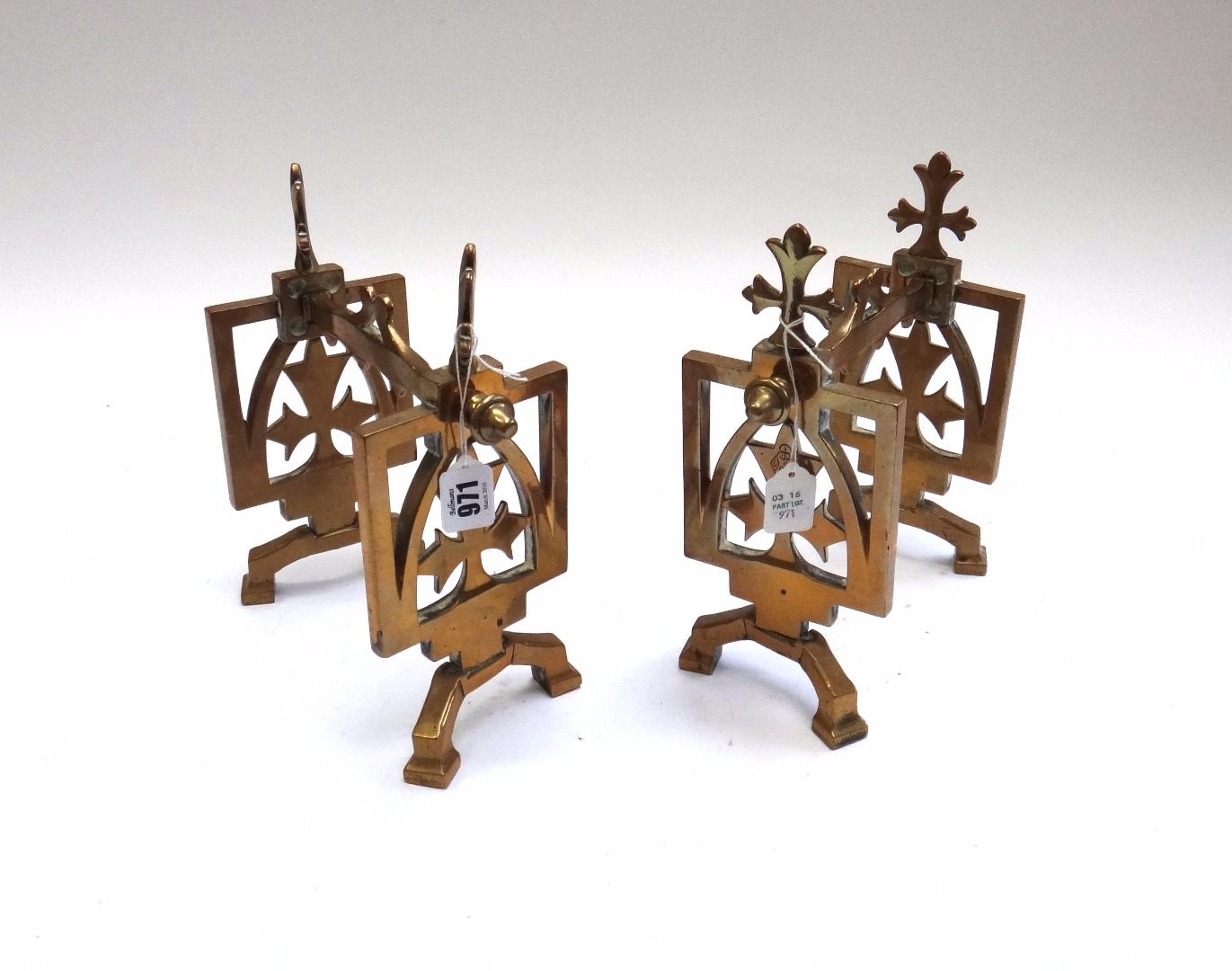 Appraisal: A pair of Victorian brass andirons of angular Arts and