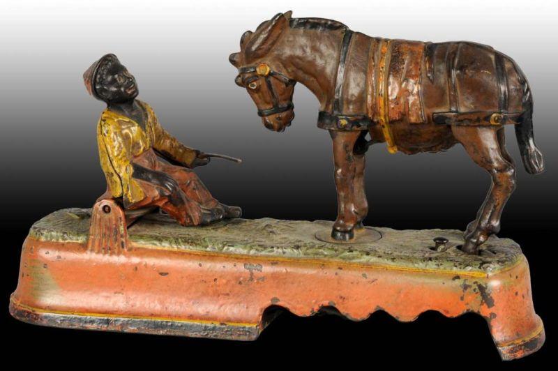 Appraisal: Cast Iron Always Did 'Spise A Mule Mechanical Bank Description