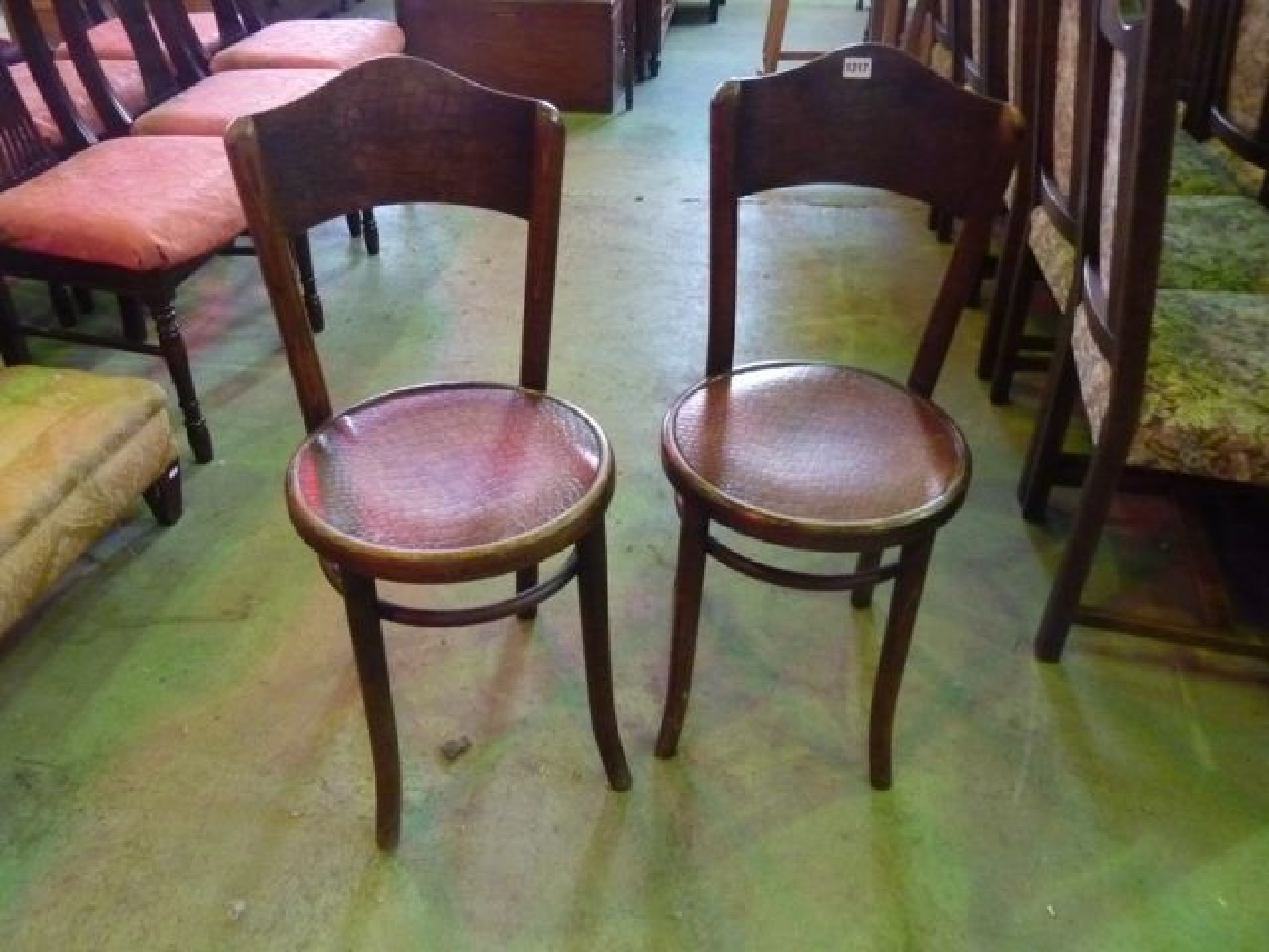 Appraisal: A pair of vintage bentwood caf chairs with simulated crocodile