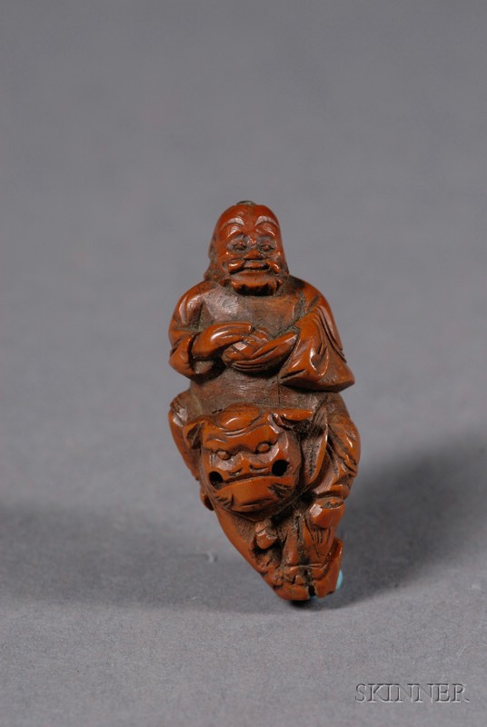 Appraisal: Carved Peach Pit China th century figure of Boddhiharma on