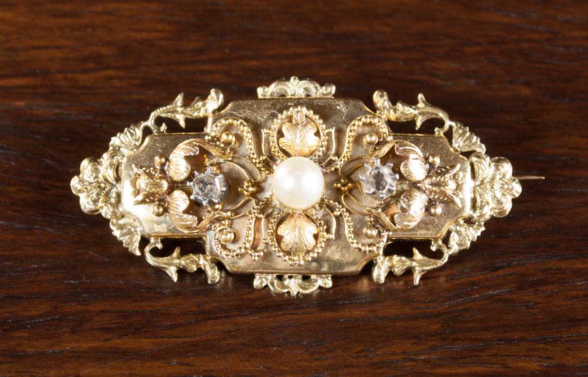 Appraisal: PEARL DIAMOND AND FOURTEEN KARAT GOLD BROOCH set with two