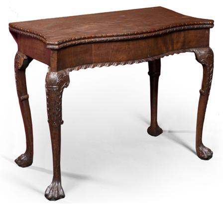 Appraisal: GEORGE III IRISH MAHOGANY SERPENTINE CARD TABLE CIRCA the shaped