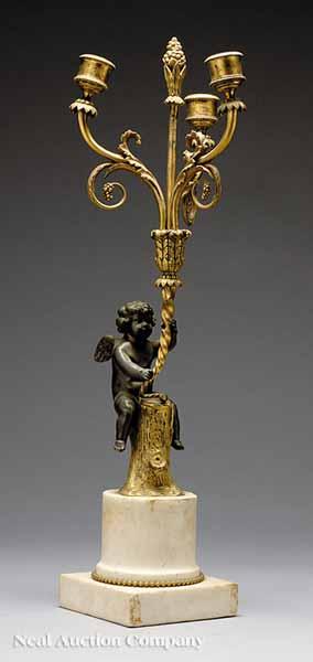 Appraisal: A French Gilt and Patinated Bronze Three-Light Figural Candelabrum early