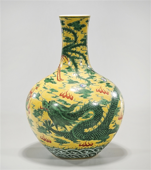 Appraisal: Chinese enameled porcelain vase depicting dragons chasing pearls x approx