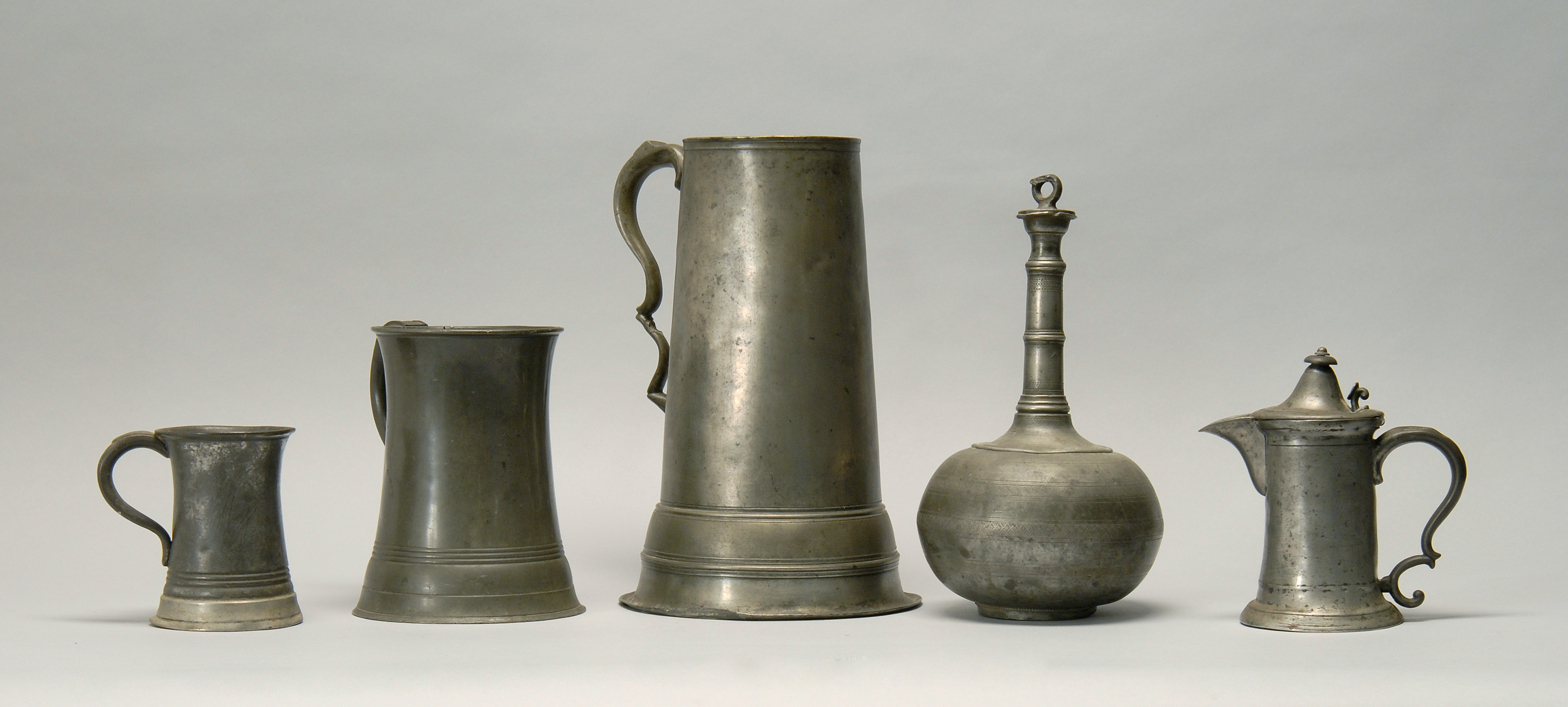 Appraisal: FIVE ANTIQUE PEWTER ITEMS English and Continental Early th CenturyA