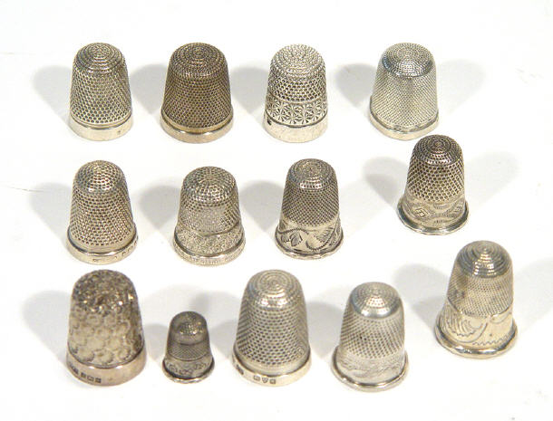 Appraisal: Collection of silver thimbles some with embossed floral decoration and