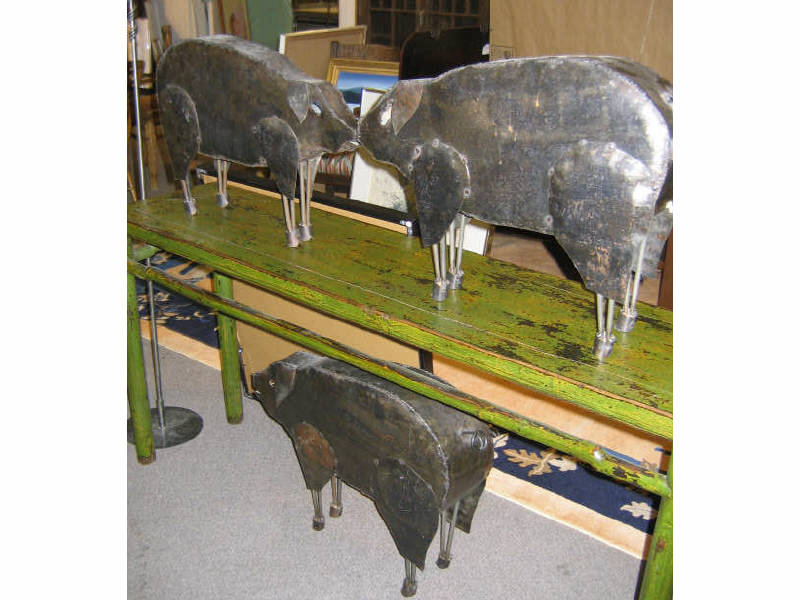 Appraisal: THREE HAND-CRAFTED METAL PIGS each of graduated size l -