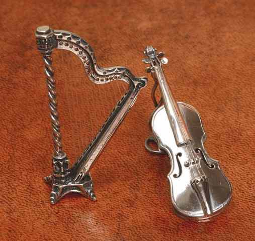 Appraisal: A CONTINENTAL SILVER VIOLIN AND STAND and a harp