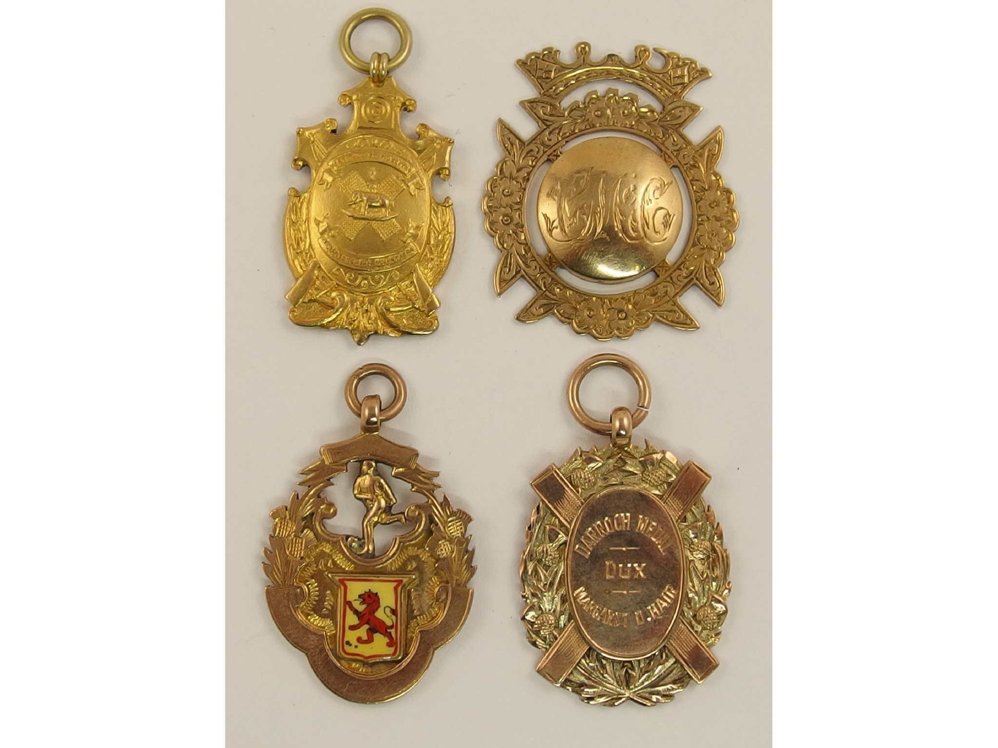 Appraisal: Four ct medallions three with a Scottish theme approx weight