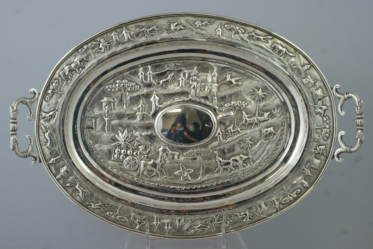 Appraisal: Indian Silver oval tray Cutch with village scenes in center