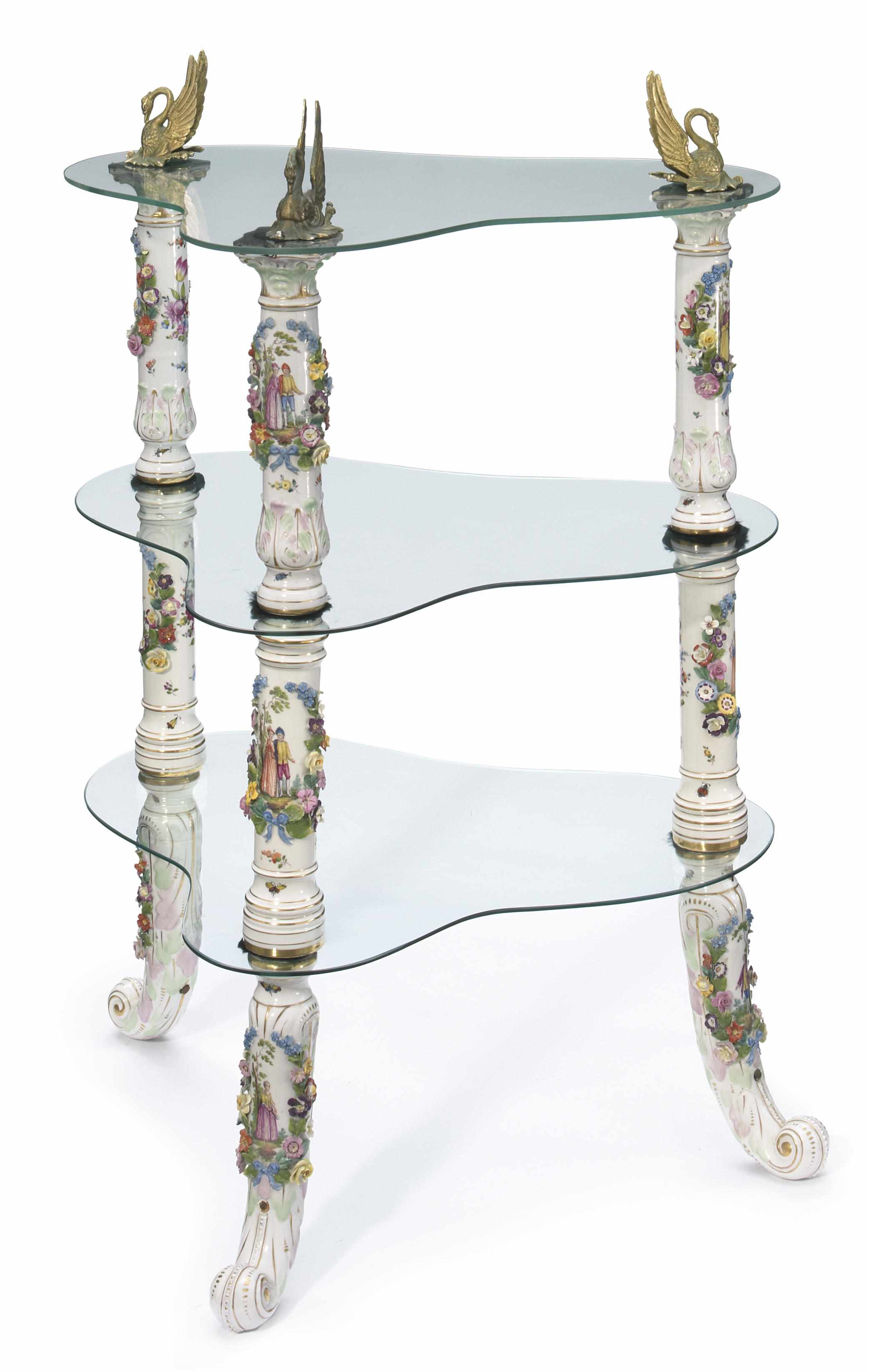 Appraisal: A German porcelain gilt metal and glass three tier tagre