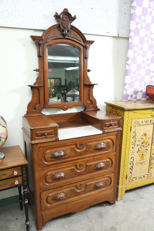 Appraisal: VICTORIAN DRESSER Walnut having a carved mirror candle shelves handkerchief