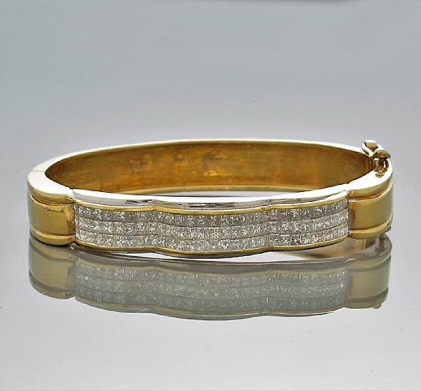 Appraisal: A diamond bangle bracelet invisibly set estimated total diamond weight