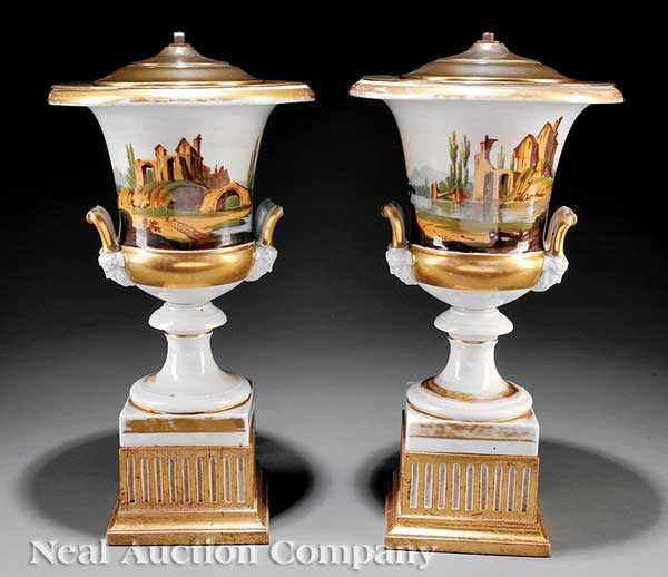 Appraisal: A Pair of Paris Porcelain Gilt and Polychrome Campagna Urns