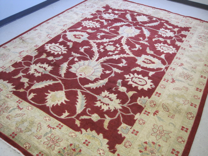 Appraisal: HAND KNOTTED ORIENTAL CARPET Pakistani-Persian leaf and vine motif across