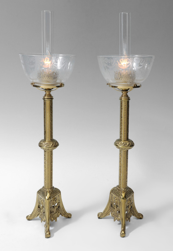 Appraisal: PAIR BRASS TABLE LAMPS Cast brass bases with embossed designs