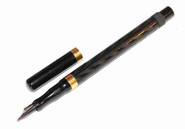 Appraisal: AN ONOTO SELF FILLING BLACK RUBBER FOUNTAIN PEN with ct