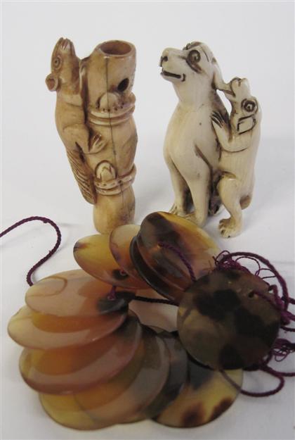 Appraisal: Three Asian miniature carvingsComprising a Japanese elephant ivory netsuke of