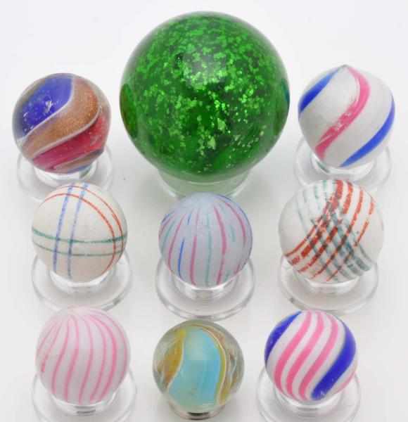 Appraisal: Lot of Handmade Marbles Description Largest is a green mica