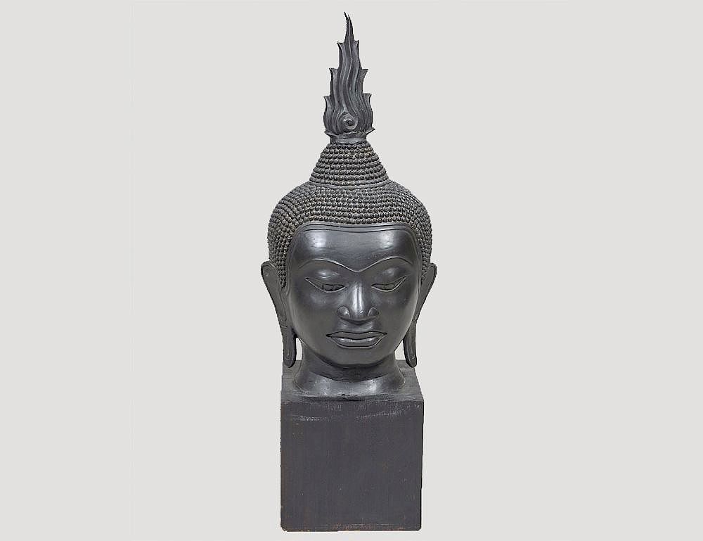 Appraisal: PATINATED BRONZE HEAD OF BUDDHA Southeast Asian Height Mounted on