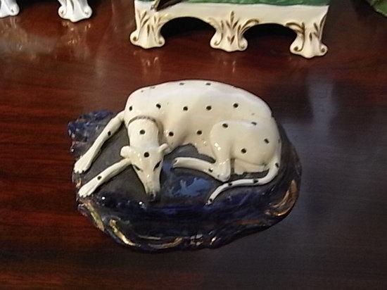 Appraisal: A SMALL STAFFORDSHIRE MODEL OF A RESTING DALMATIAN