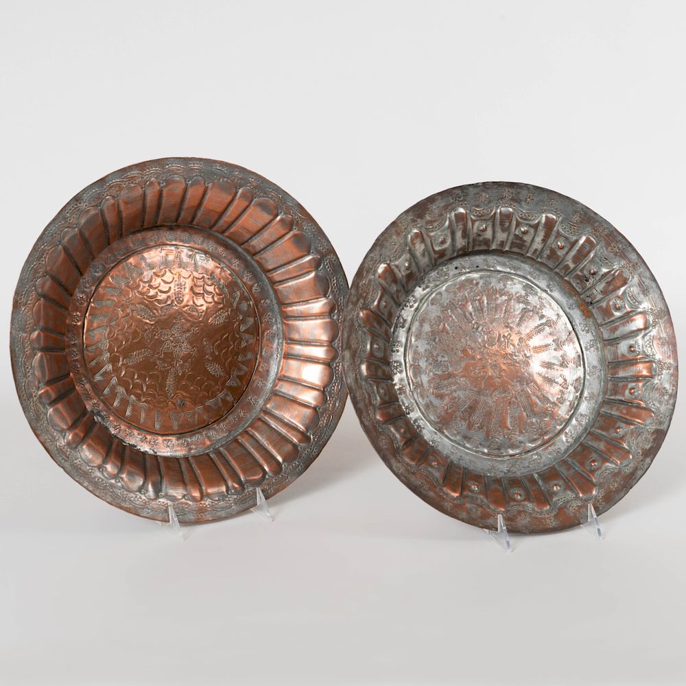 Appraisal: Mexican Repouss Copper Dishes With hangers to the reverse in