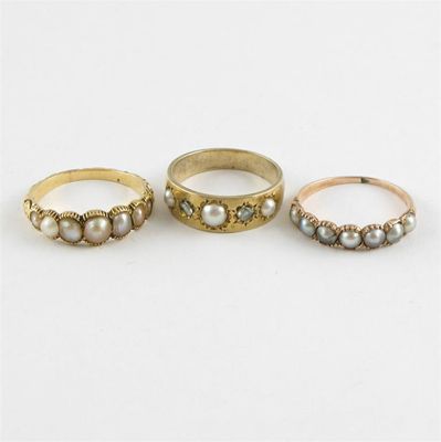 Appraisal: Two early th century gold rings set with half pearls