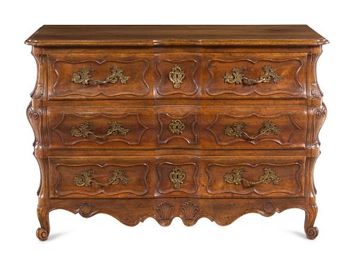 Appraisal: A FRENCH PROVINCIAL SHELL-CARVED WALNUT COMMODEA French Provincial Shell-Carved Walnut