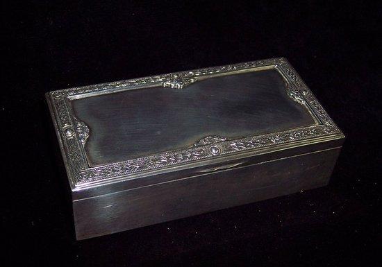 Appraisal: A cigarette box the rectangular hinged lid with border of