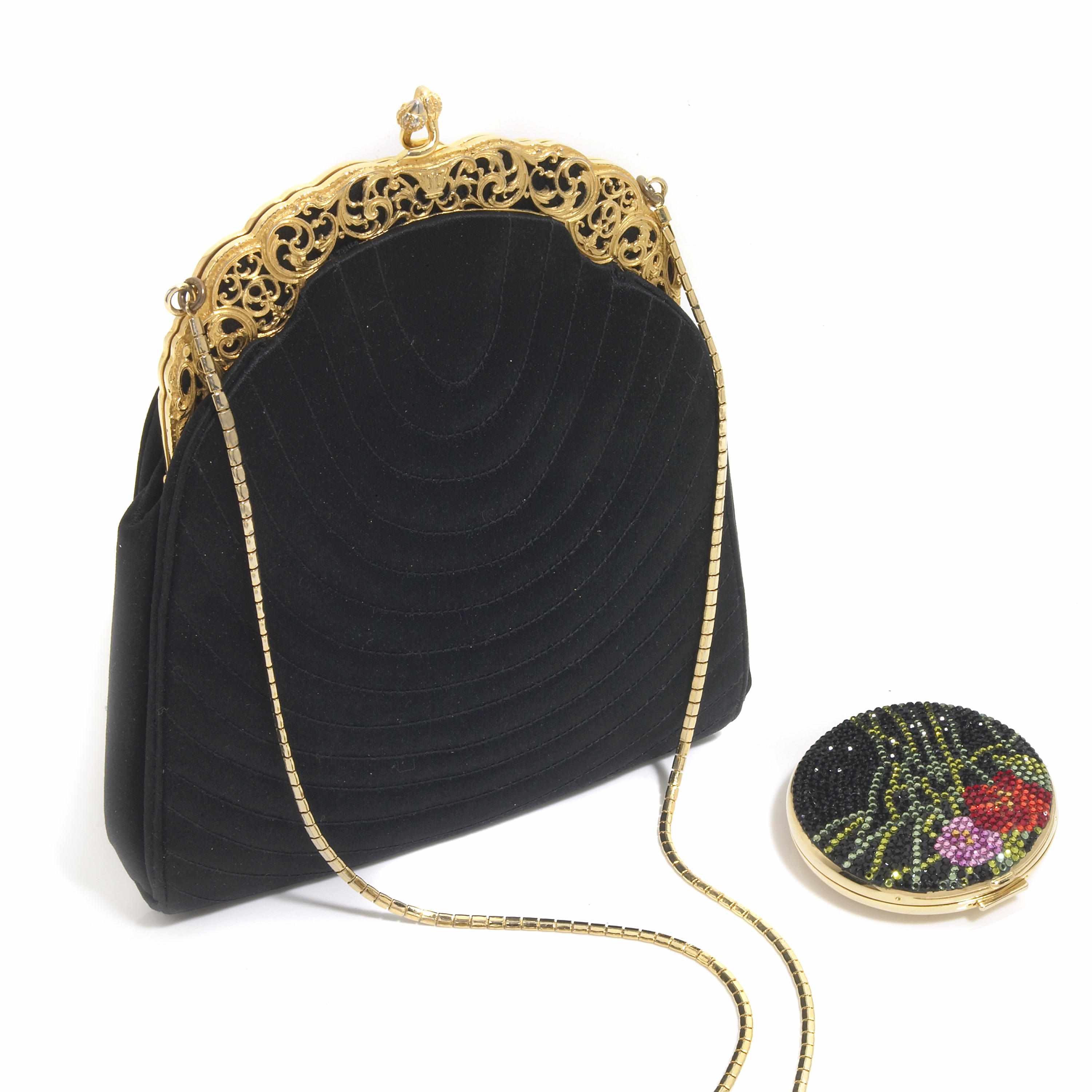 Appraisal: A black satin purse with a gold colored metal frame