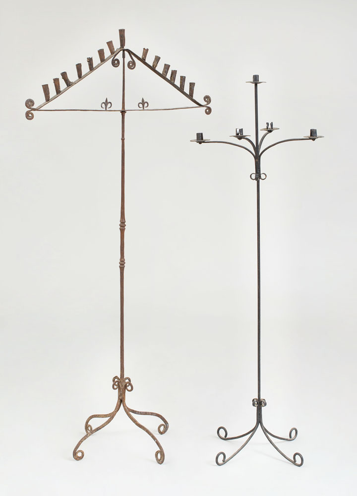 Appraisal: TWO CONTINENTAL WROUGHT-IRON FOUR-LIGHT CANDELABRAS One with fourteen lights the