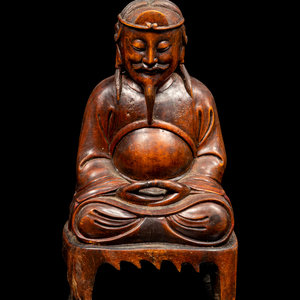 Appraisal: A Chinese Boxwood Figure of Immortal carved seated on a