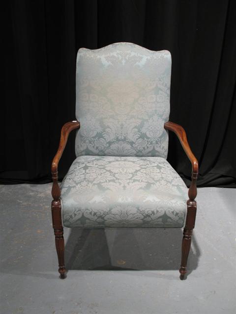 Appraisal: HEPPLEWHITE STYLE MAHOGANY ARMCHAIR The padded back above a similar