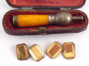 Appraisal: A mixed lot comprising a silver and amber cheroot holder