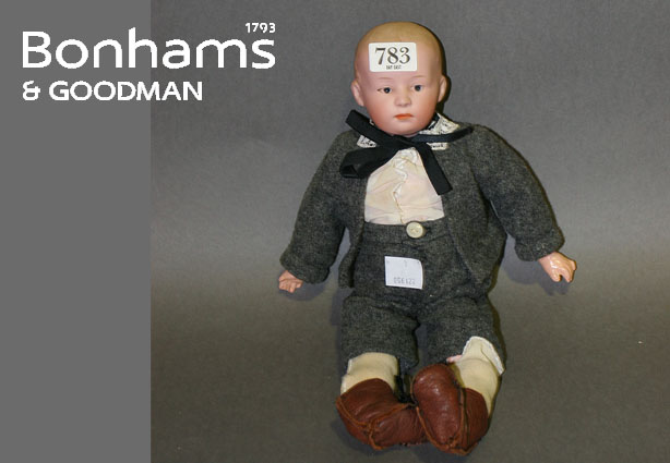 Appraisal: A Gebruder Heubach boy doll with fully jointed body moulded