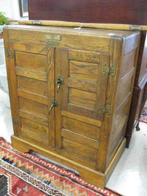 Appraisal: A LARGE TWO-DOOR OAK ICEBOX American early th century the