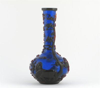 Appraisal: A Chinese Beijing blue glass bottle vase overlaid in red