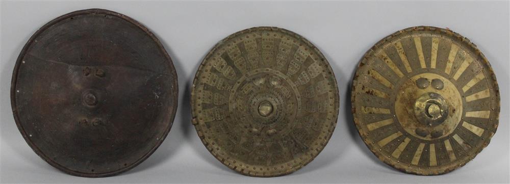 Appraisal: THREE MONGOLIAN METAL AND LEATHER SHIELDS each of circular domed