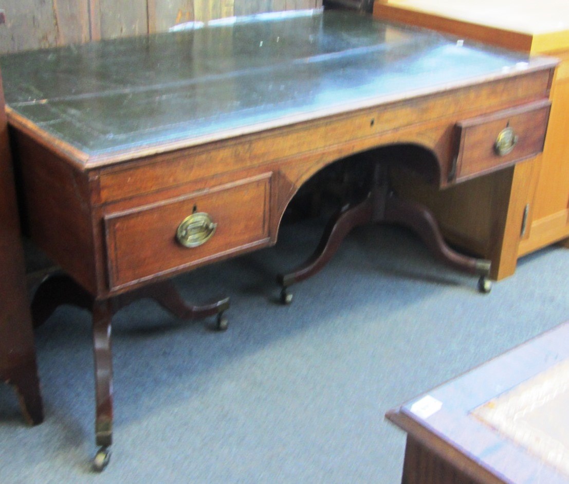 Appraisal: A George III mahogany writing desk the tooled green leather