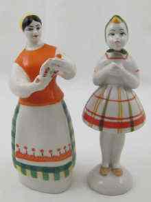 Appraisal: Two Ukrainian Soviet figures one of a woman holding an