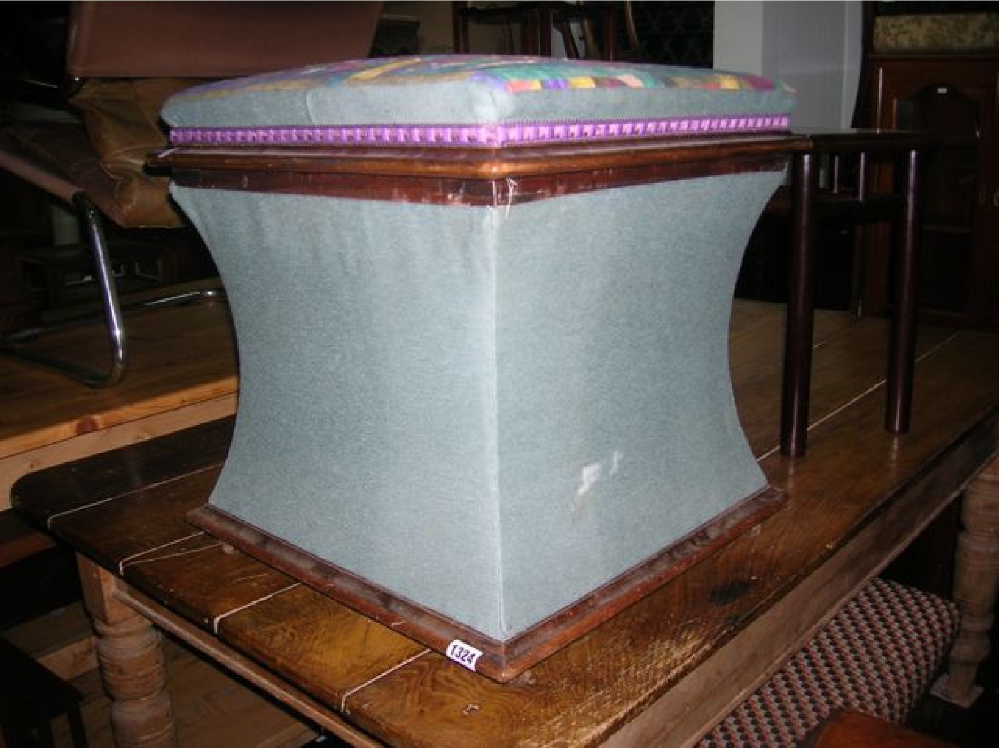 Appraisal: A Victorian box ottoman of square cut and waisted form