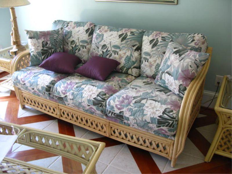 Appraisal: Rattan Sofa in a light color with tropical floral upholstery