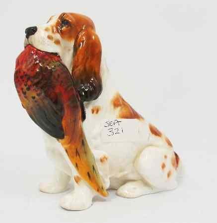 Appraisal: Royal Doulton Seated Spaniel with Pheasant HN