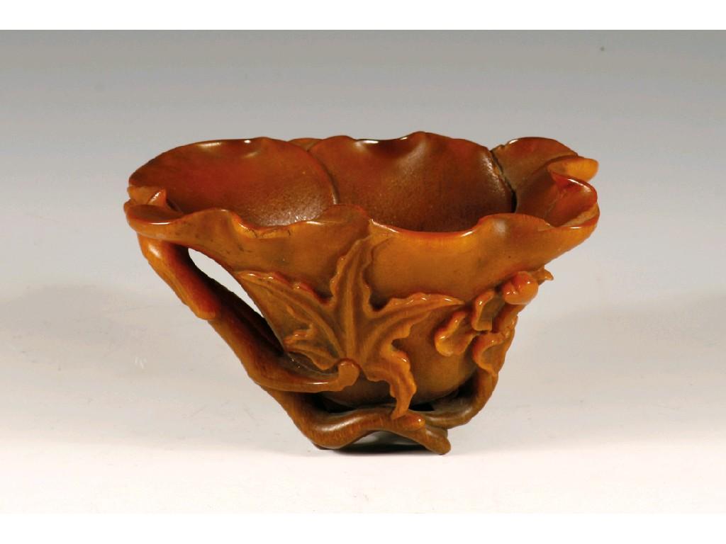 Appraisal: AN FINE CHINESE RHINOCEROS HORN LIBATION CUP carved as a