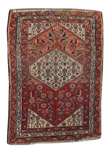 Appraisal: A HAMADAN ROSE RED GROUND RUG with central six sided