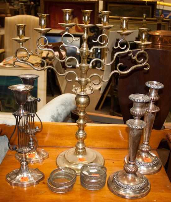 Appraisal: Brass seven-light candelabra two pairs of silver-plated candlesticks and five