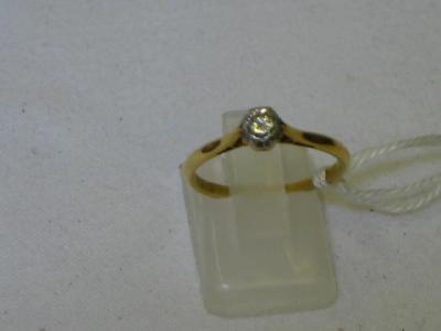 Appraisal: A SOLITAIRE DIAMOND RING in ct yellow gold shank ct